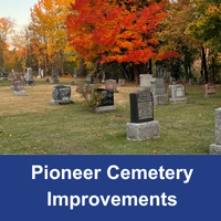 cemetery scene with headstones and a brightly coloured fall trees behind with a blue box at the bottom with the words Pioneer Cemetery Improvements